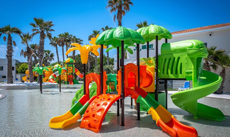 Colorful water park with slides and play structures for kids.